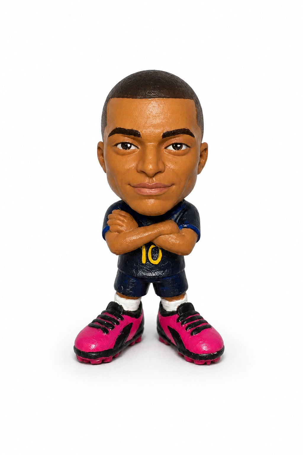 Kylian Mbappé — Arms Crossed, Eyes Forward.